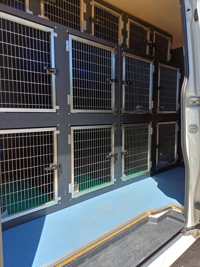 Secure pet travel crates fitted inside the van